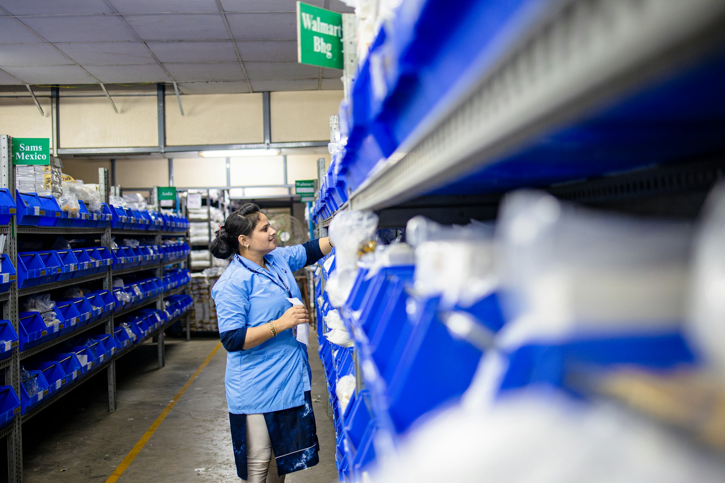 Warehouse worker locating industrial inventory