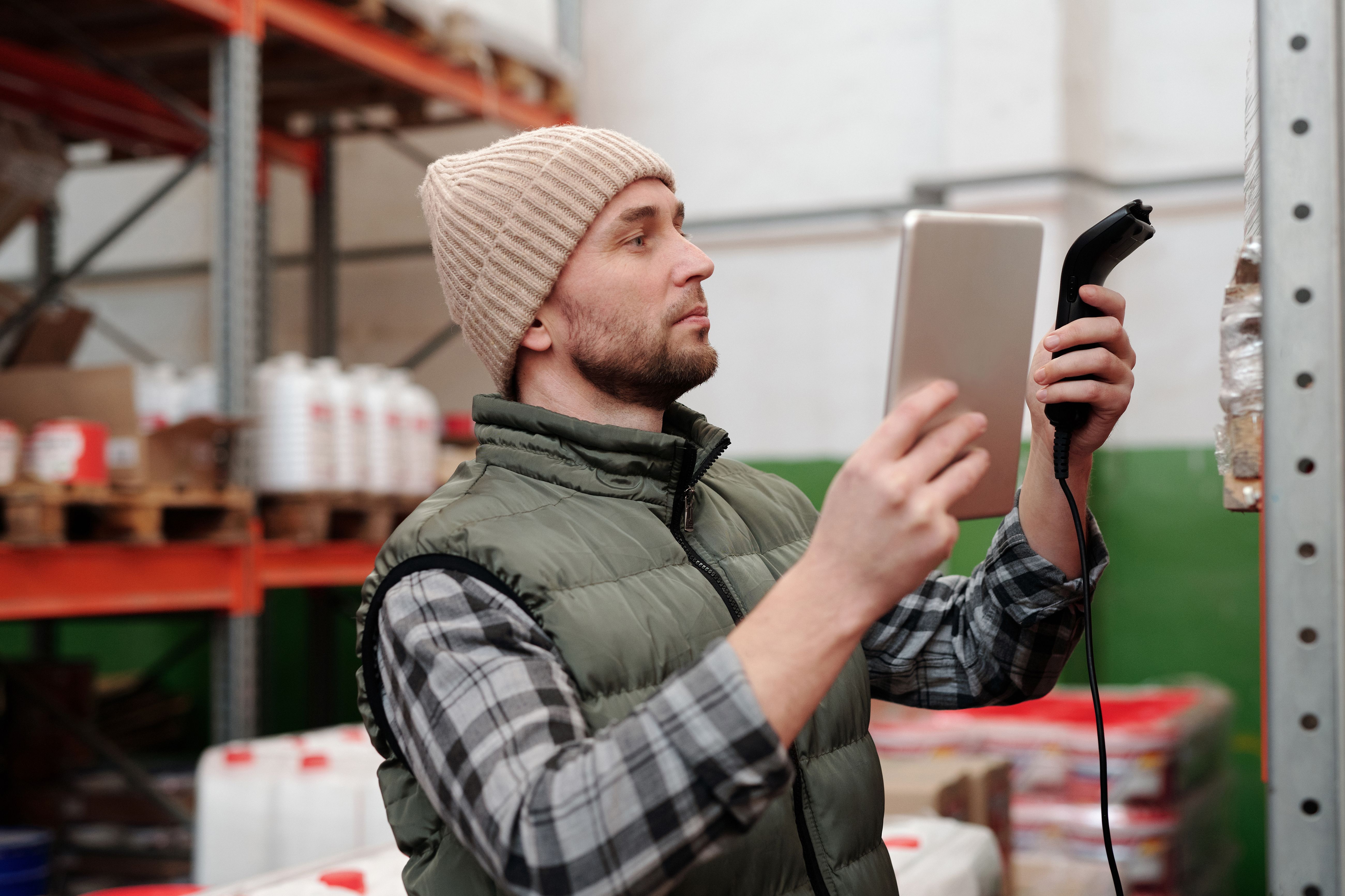 Warehouse worker scanning industrial inventory